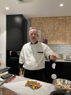 Chef Martin preparing/demonstrating the Salmon Fillet en Papillotte dish (recipe)